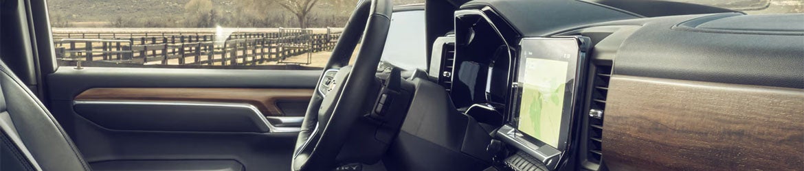 Close-up of the 2026 Chevrolet Silverado 1500 steering wheel, showcasing premium materials and advanced controls, offering comfort and precision for drivers in Buellton, CA.